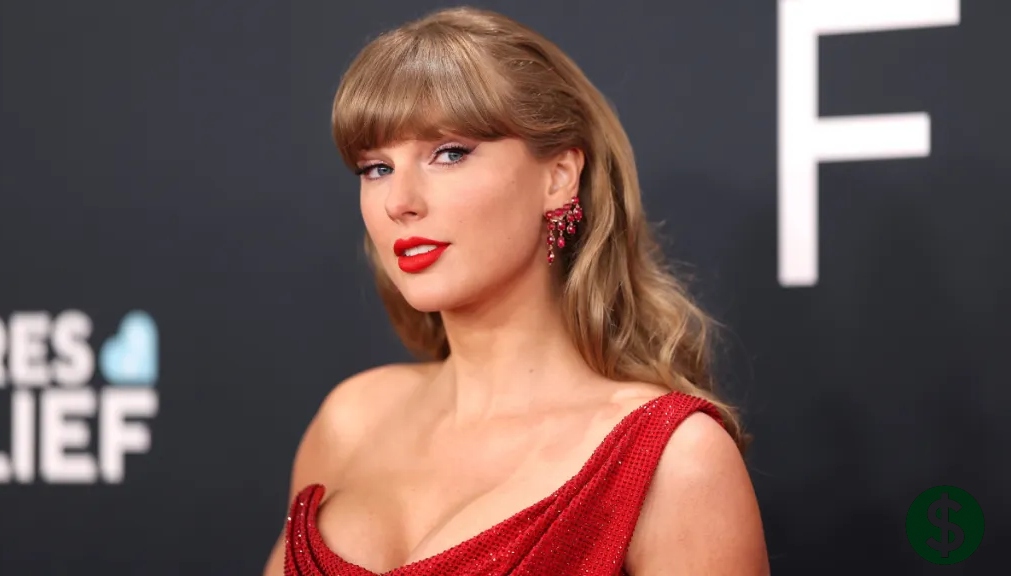 Taylor Swift net worth highlighted as the American singer appears in a red gown at a high-profile awards event, showcasing her global success and influence.
