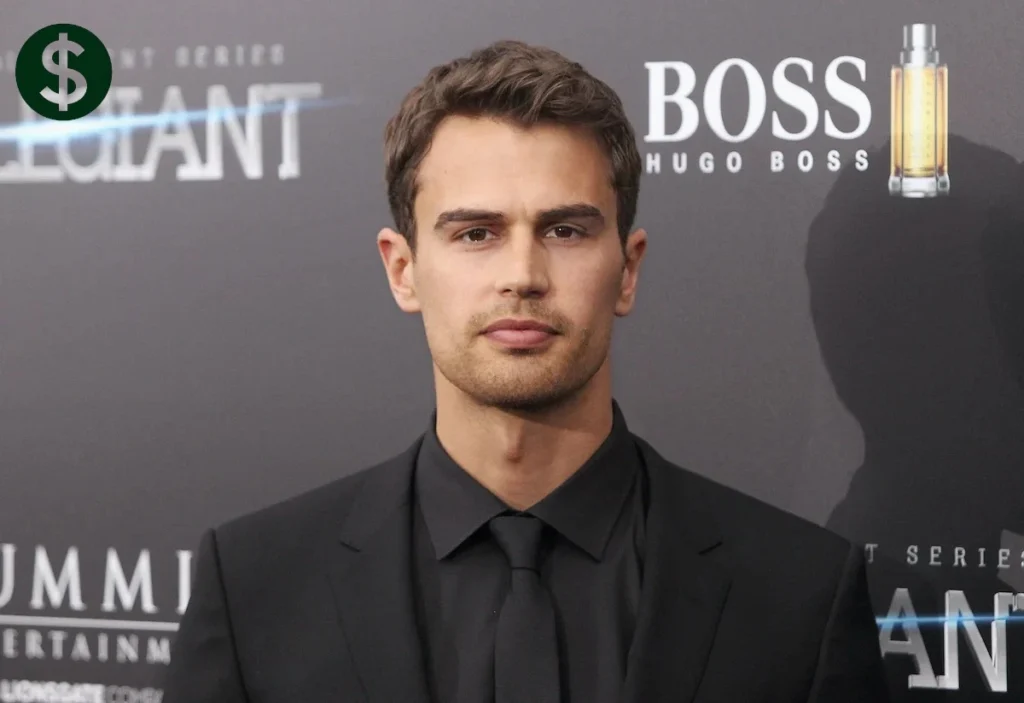Theo James net worth rises as the British actor appears at a film premiere in a black suit