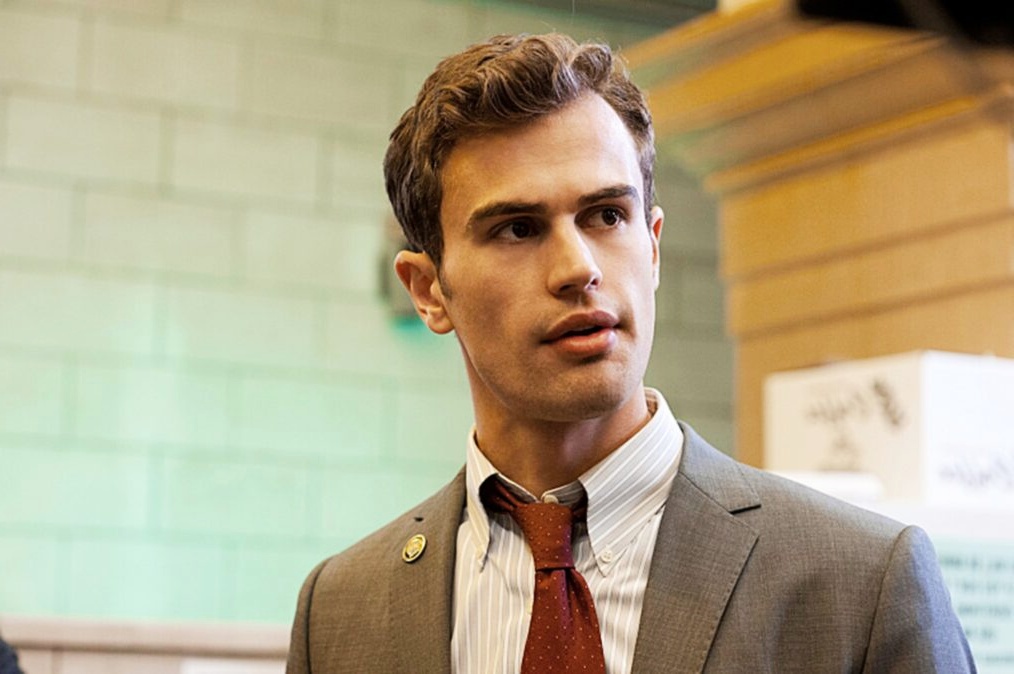 Theo James net worth highlighted as the actor appears in a professional role, known for his successful Hollywood career